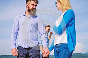 Boyfriend full jealous looks aggressive cheaters couple. Man found or detected girlfriend cheating him walking with