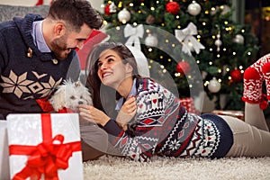 Boyfriend giving puppy dog as Christmas present to girlfriend