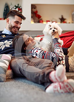 Boyfriend giving puppy dog as Christmas present to girlfriend