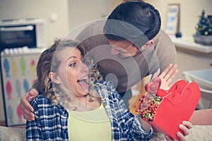 Boyfriend and his girlfriend celebrating holiday. Young couple