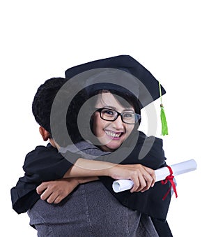 Boyfriend hug girlfriend on graduation - isolated