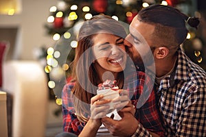 Boyfriend kiss woman on Christmas Eve