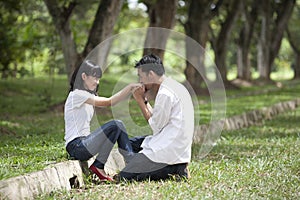 A boyfriend kissing girflfriend's hand