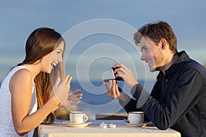 Boyfriend requesting hand of his girlfriend with a engagement ring