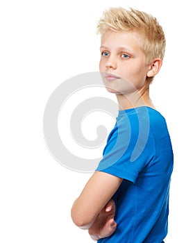 Boyhood dreams. Cropped studio shot of a blond teenage boy standing against a white background.