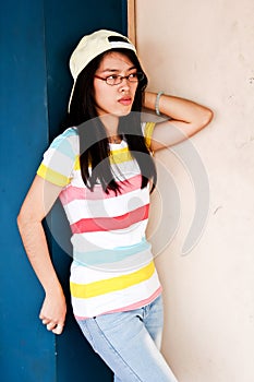 Boyish Pretty young Asian girl with glasses