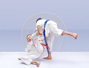 Boys athletes train judo throws