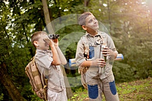 Boys on camping trip in the forest exploring