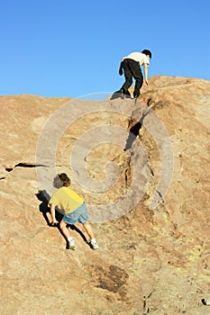 Boys climbing on rocks