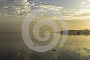 Boys fishing at dawn in Mandalay, Myanmar