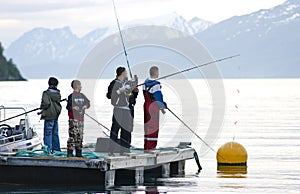 Boys fishing on fjord