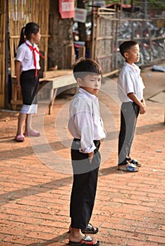 Boys and girl waiting to go to school