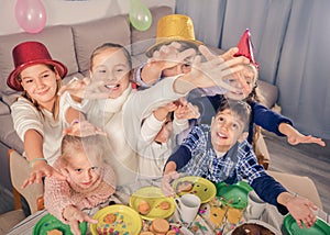 Boys and girls behaving jokingly during friendâ€™s birthday part