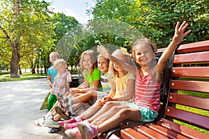 Boys and girls on the bench in park