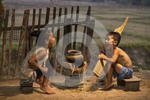 Boys and girls laughing merrily. Rural children playing with blowing music and laughter. People Thailand