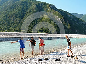 Boys going to bathe in Fella river, Northeast Italy photo