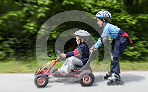 Boys gokart and roller blades