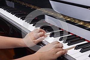 Boys hands on Piano keys