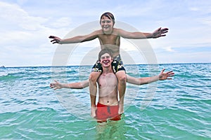 Boys having fun in the beautiful sea