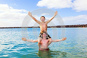 Boys having fun in the clear sea