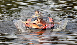 Boys Having Fun on Inflatable Rubber Boat