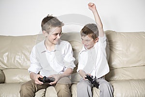 Boys having lots of fun with video games