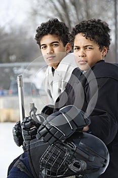 Boys in hockey uniforms.