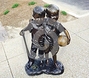 Boys Holding Basketball Statue