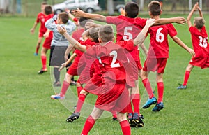 Boys kicking ball