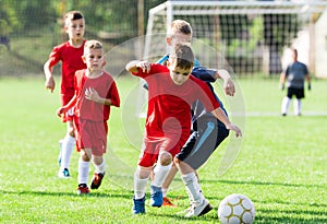 Boys kicking ball