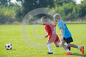 Boys kicking ball