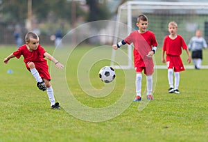 Boys kicking ball