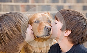 Boys Kissing a Dog