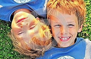 Boys luying on grass