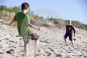 boys play Beach football