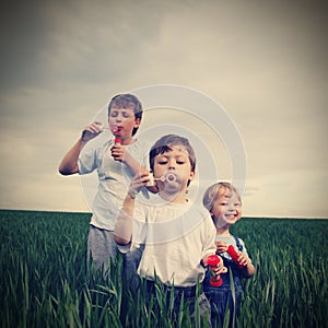 Boys play in bubbles