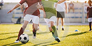 Boys Play Football. Running Football Soccer Players. Kids at Soccer Field Running with Ball