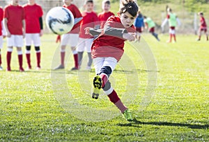 Boys play soccer sports field