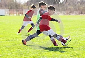 Boys play soccer sports field