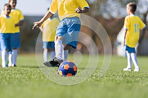 Boys play soccer sports field