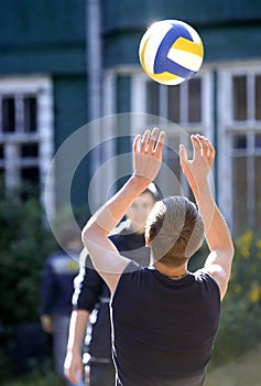 Boys play volley ball