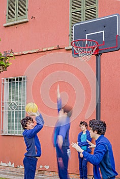 Boys playing basketball