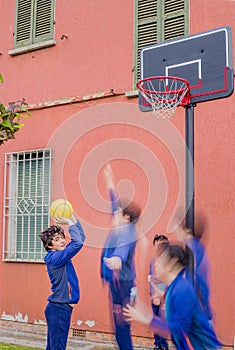 Boys playing basketball