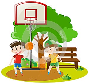 Boys playing basketball in the park