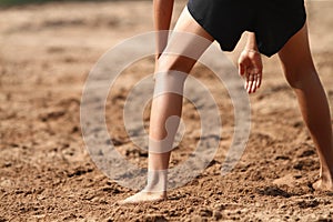 A boys playing beach volleyball