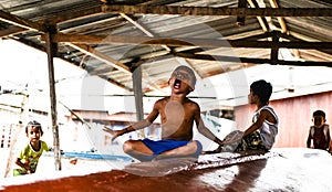 Boys playing in a boat