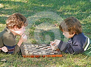 Boys Playing Checkers photo