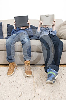 Boys playing games on a Tablet