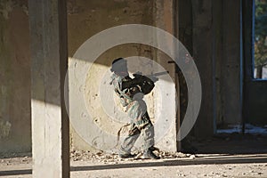 Boys playing with gun during laser tag
