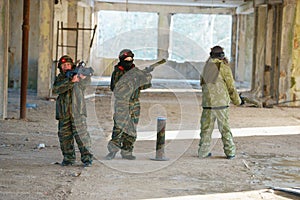 Boys playing with gun during laser tag